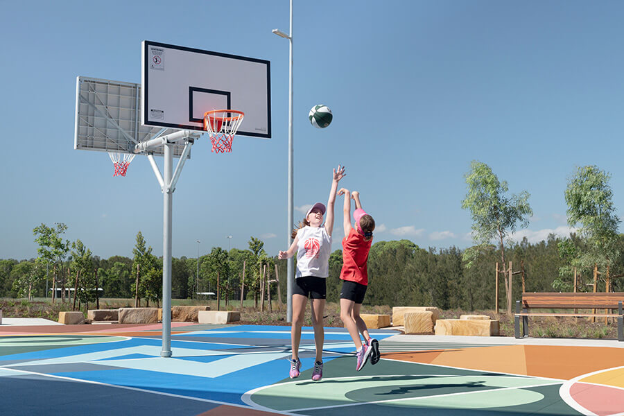 People playing basketball at the new park in Beaumont Hills. Credit: NSW Department of Planning, Housing and Infrastructure 