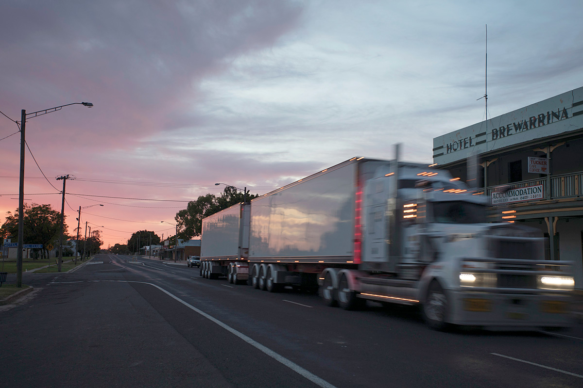 A truck drives down Kamilaroi Highway at sunrise in Brewarrina, NSW. Credit: NSW Department of Planning and Environment / Quentin Jones