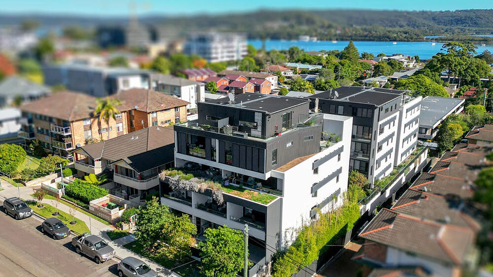 Viciniti Apartments seamlessly integrates extensive private and shared garden spaces, and offering captivating water views. Credit: McKean Photo. Source: CKDS Architecture