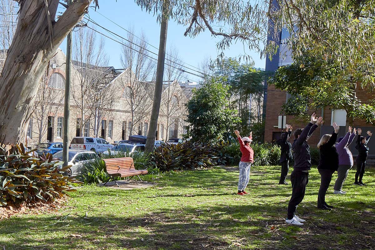 Group of people exercising in a park opposite The Gantry, Camperdown. Credit: Martin Mischulnig / Government Architect NSW