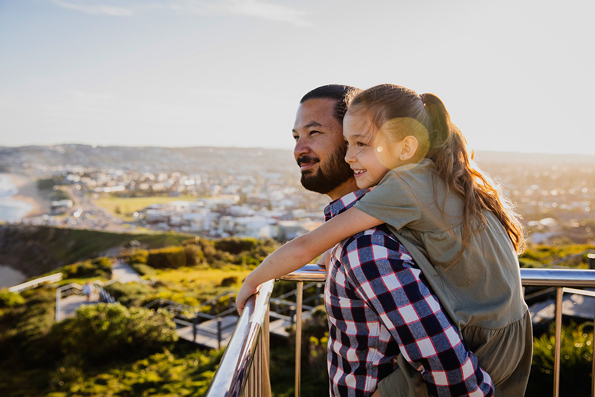 Father and daughter enjoying a walk along the Newcastle Memorial Walk, The Hill. Credit: Destination NSW