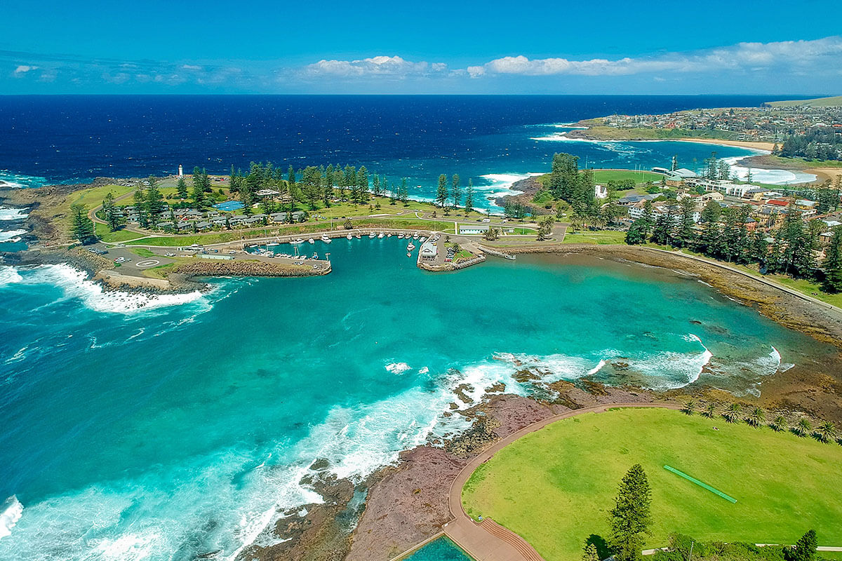 Aerial overlooking Kiama Harbour and the Continental Ocean Pool in Kiama. Credit: Mark Fitzpatrick; Destination NSW