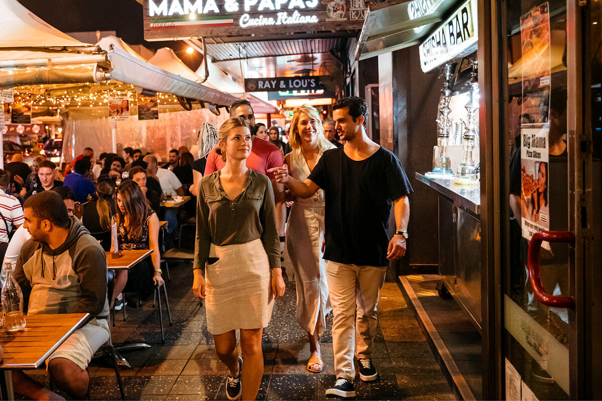 People dining at restaurants along Eat Street dining precinct in Parramatta.