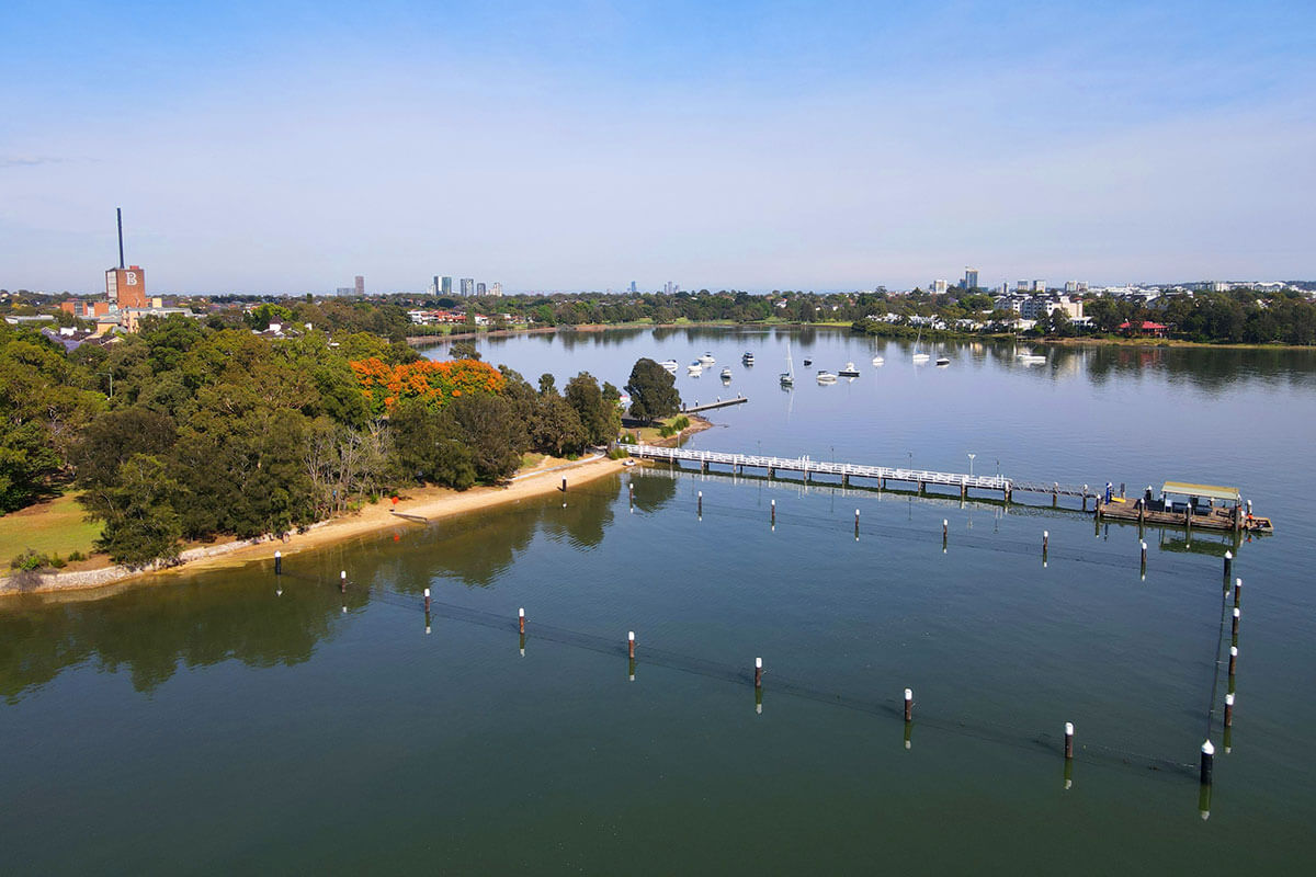 Bayview Baths - a calm swimming area protected by shark nets in an ocean bay. The baths are surrounded by parklands.