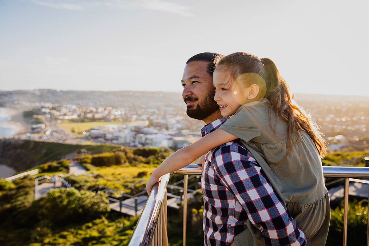 Father and daughter enjoying a walk along the Newcastle Memorial Walk, The Hill. Credit: Destination NSW