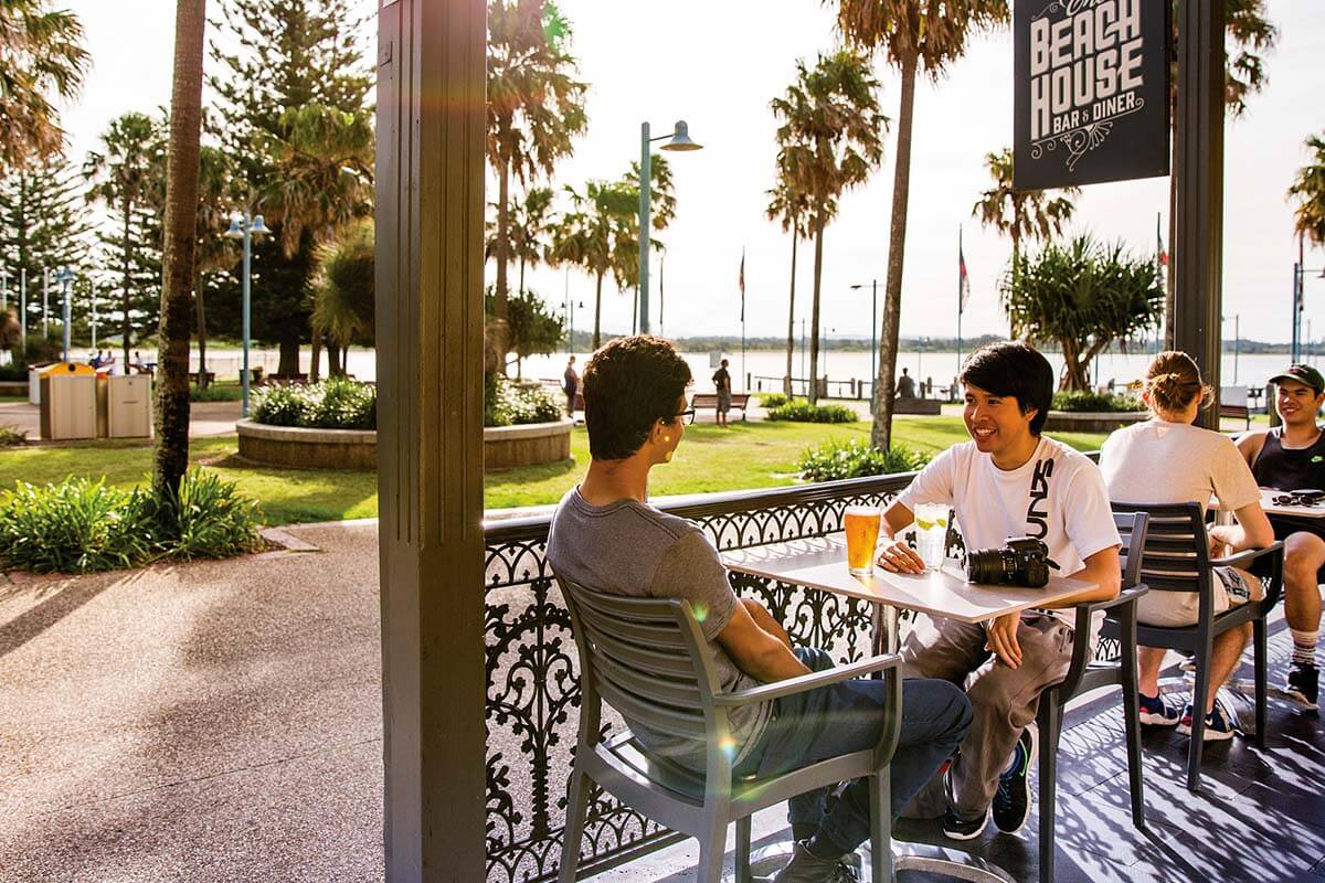 Friends enjoying afternoon drinks at The Beach House Restaurant and Bar, Port Macquarie.