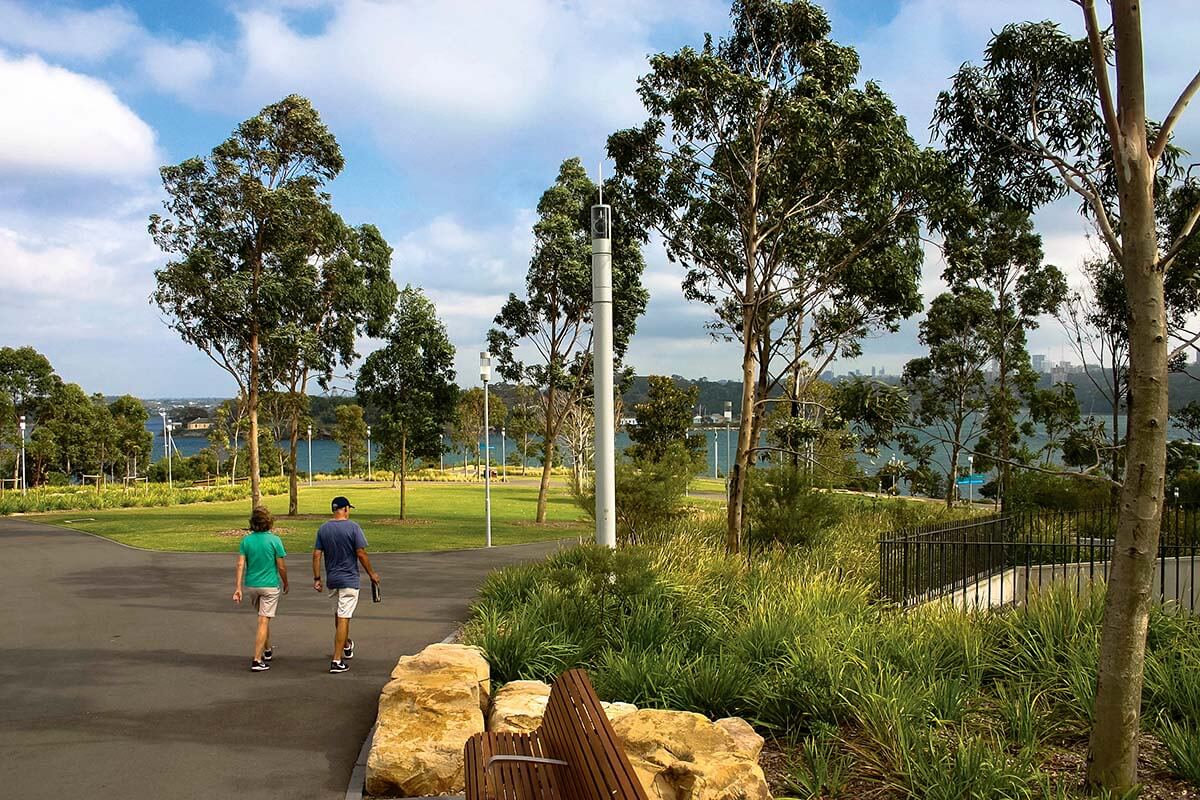 Man and woman couple walk through park - Barangaroo, Sydney NSW. Credit: NSW Department of Planning and Environment