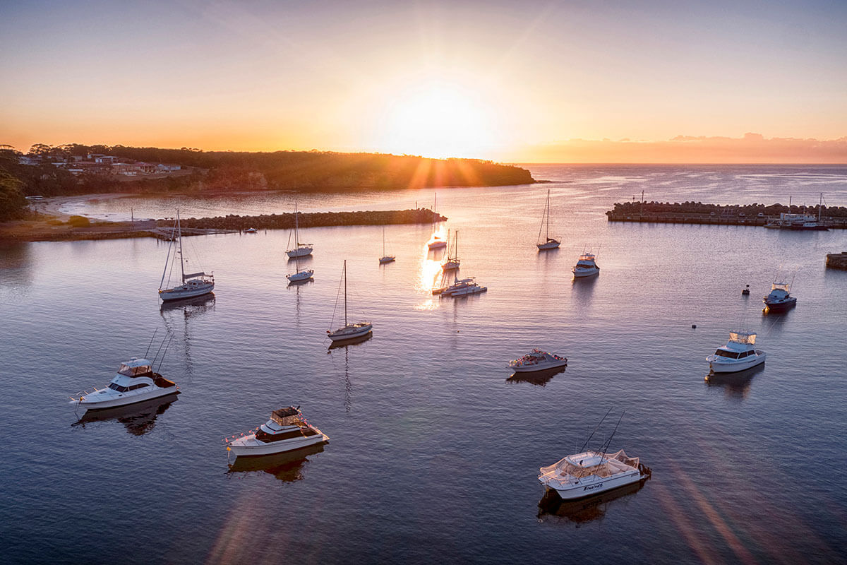 A birds-eye view of boats in Ulladulla Harbour. Credit: NSW Department of Planning, Housing and Infrastructure / Kramer Photography